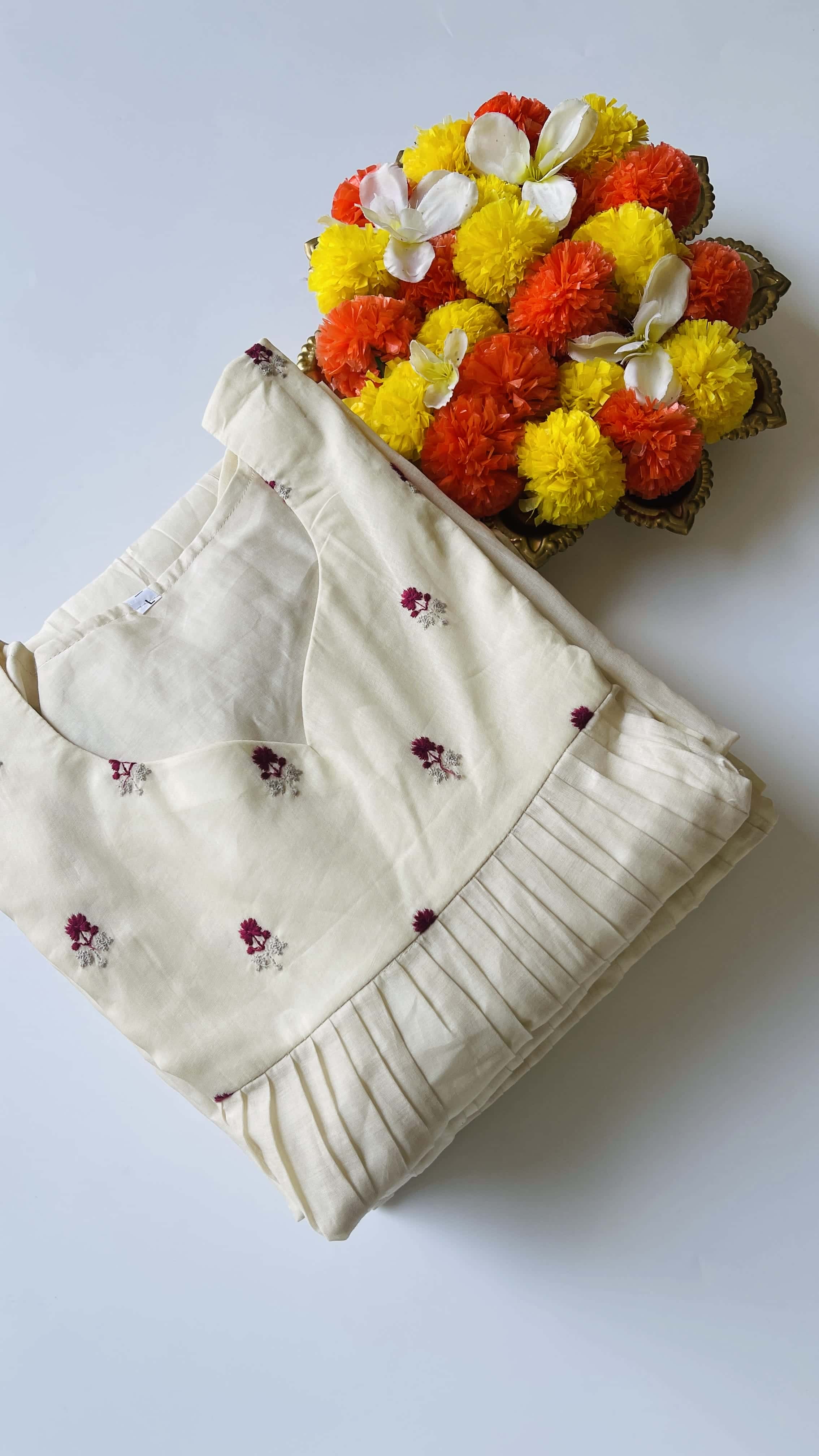 Off white small magenta flowers top