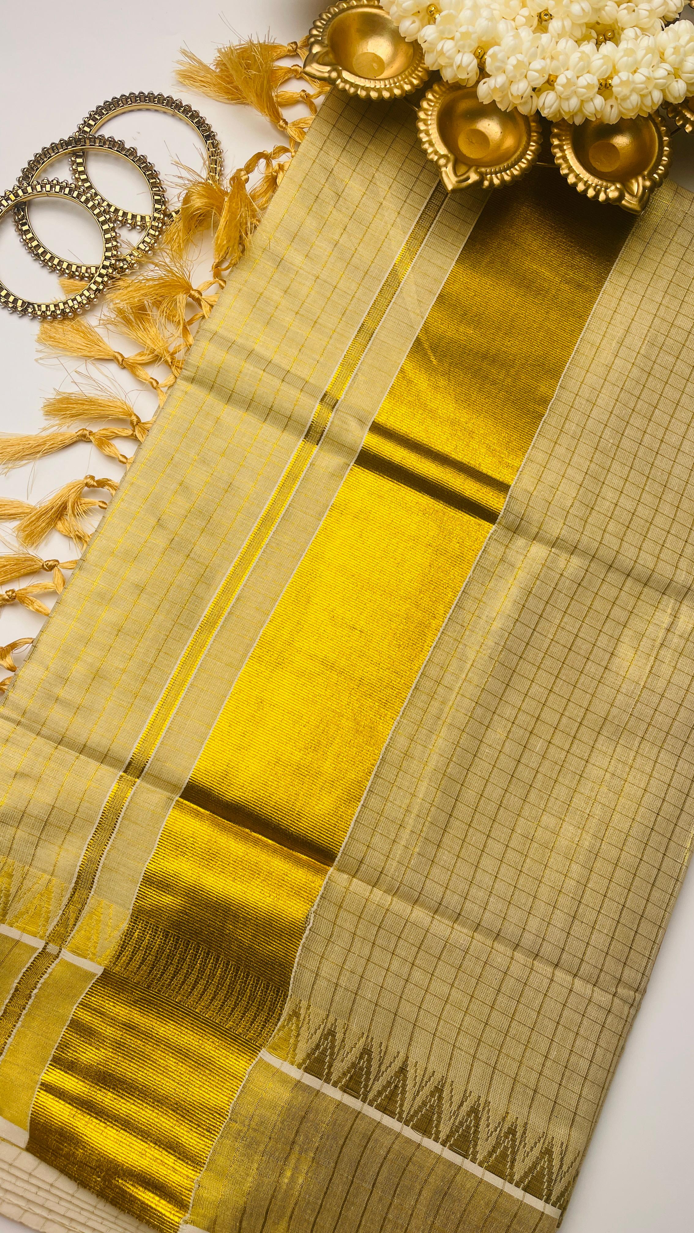 Check saree with golden tassels