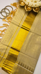Check saree with golden tassels