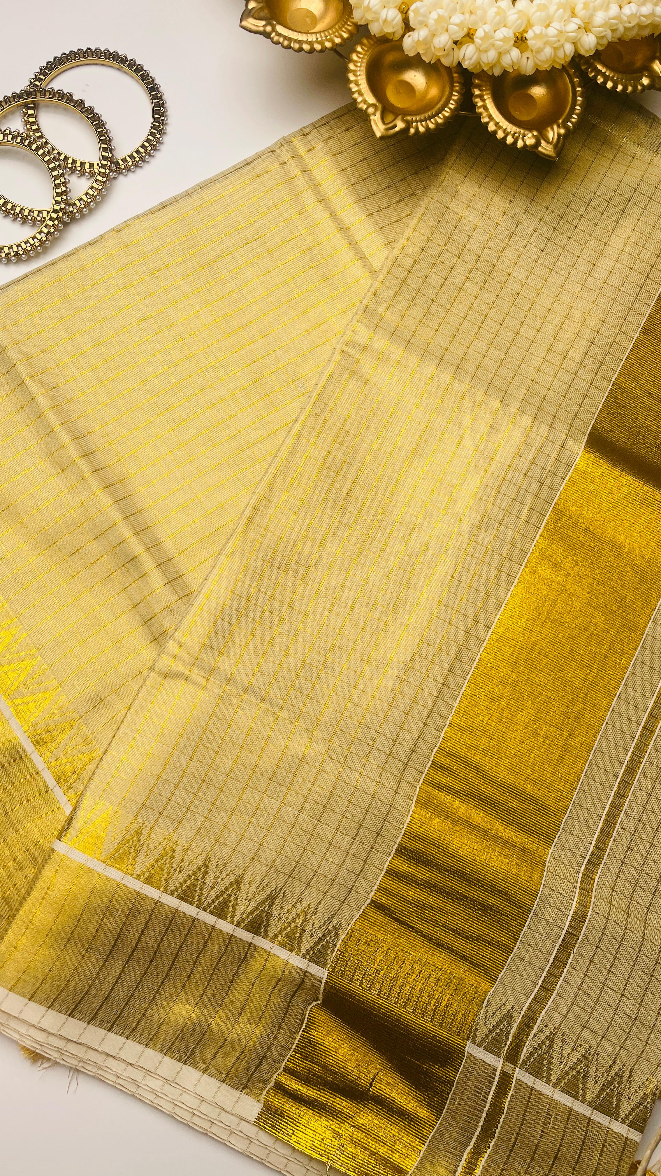 Check saree with golden tassels