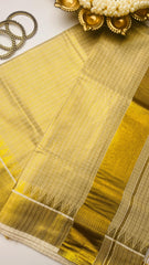 Check saree with golden tassels