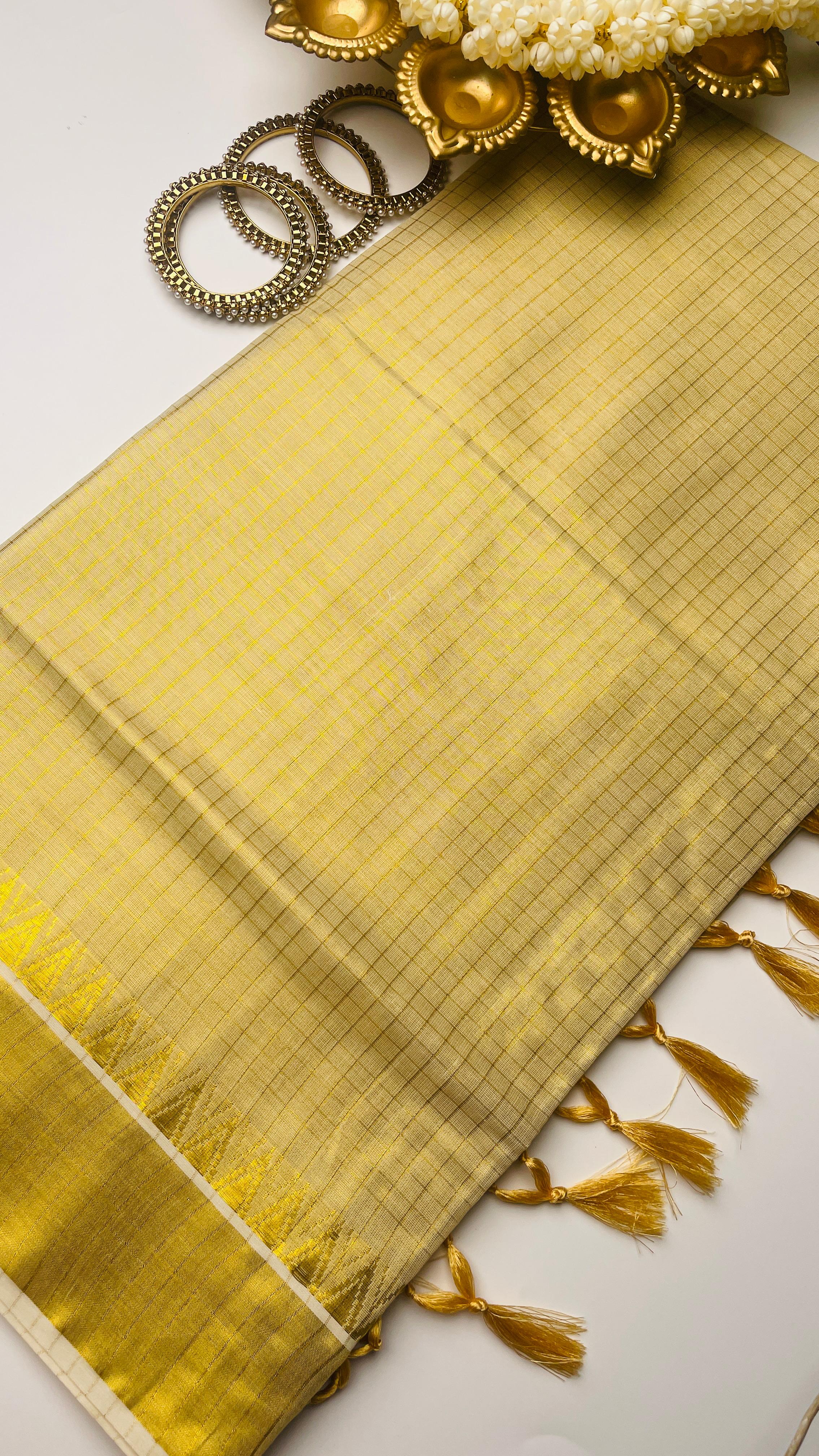 Check saree with golden tassels