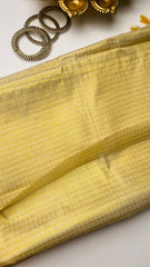 Check saree with golden tassels